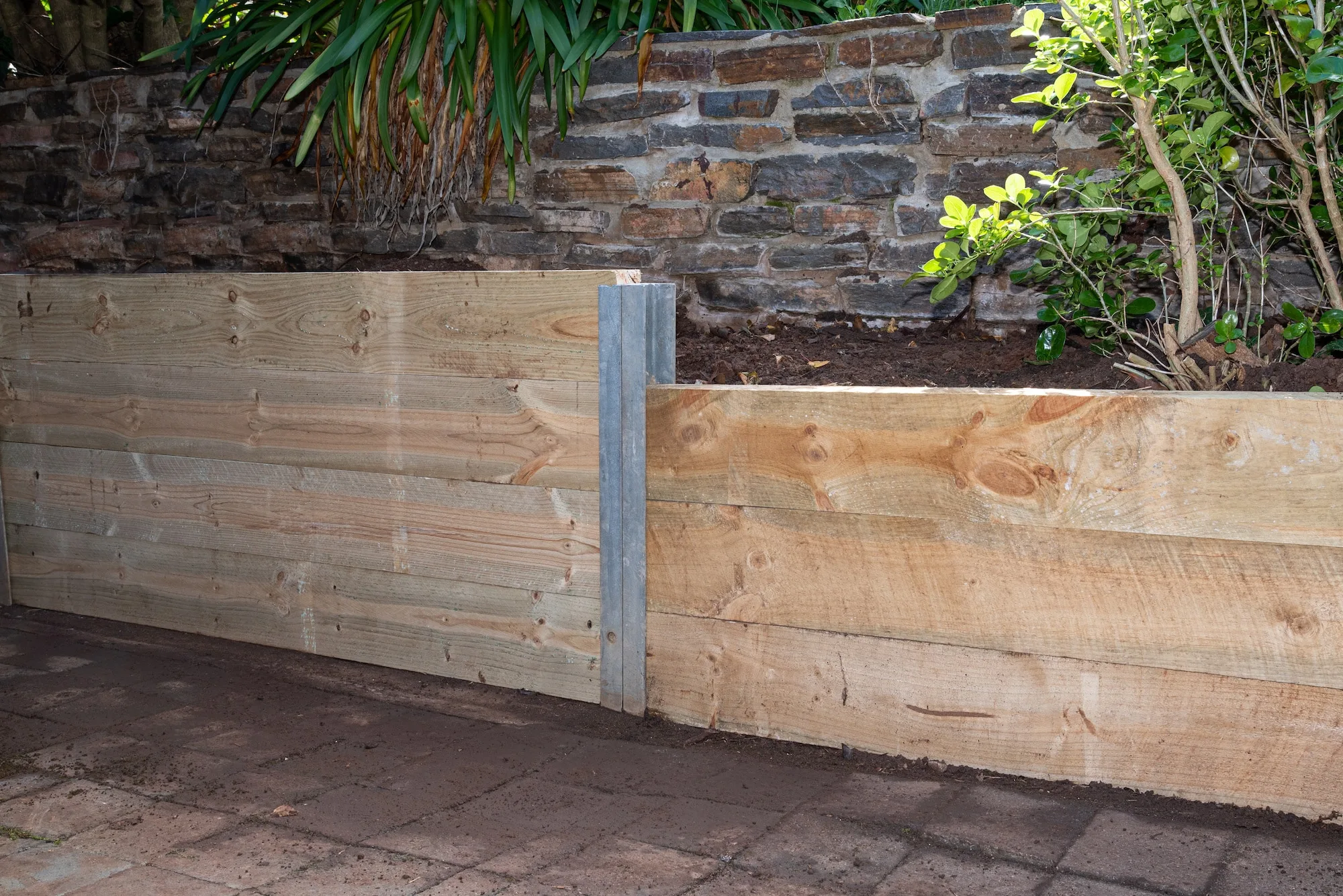 Timber retaining wall installed in a Berwick garden